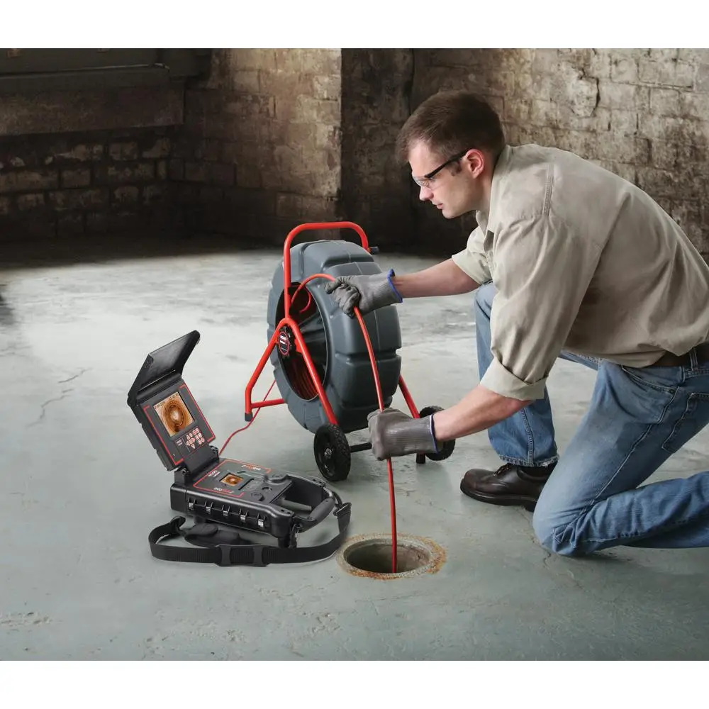 Plumber Using Sewer And Drain Camera