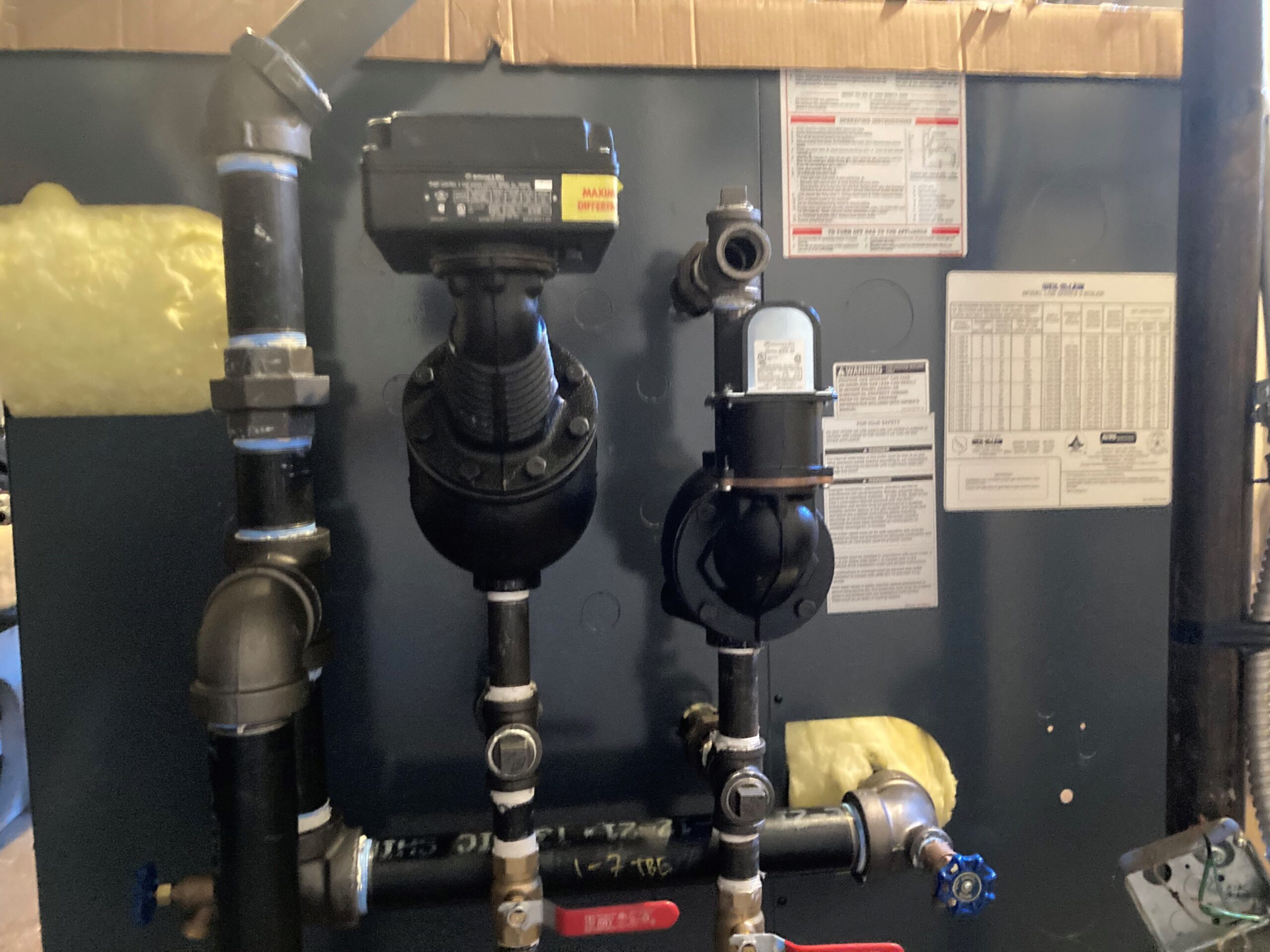 Boiler system with valves, pipes, and control units.