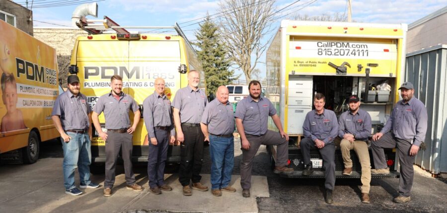 PDM Team In Front Of Trucks