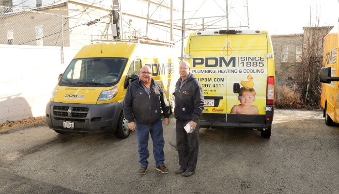 PDM Two Plumbers and Trucks