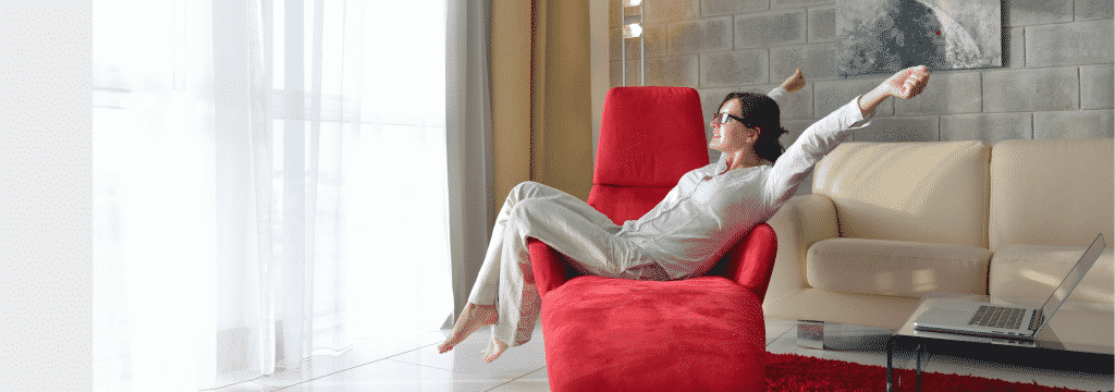 Woman relaxing sitting on red chair with peace of mind